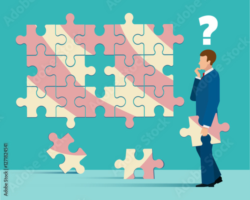 Businessman tries to put together puzzle