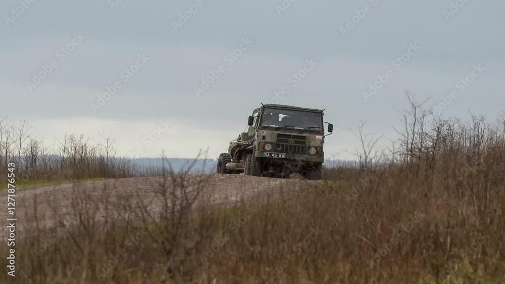 British army bae systems, Puch, Daimler, Pinzgauer High-Mobility All-Terrain 6x6 vehicle towing a 105mm Light Artillery Gun on a military exercise British army bae systems, Puch, Daimler, Pinzgauer High-Mobility All-Terrain 6x6 vehicle towing a 105mm Light Artillery Gun on a military exercise