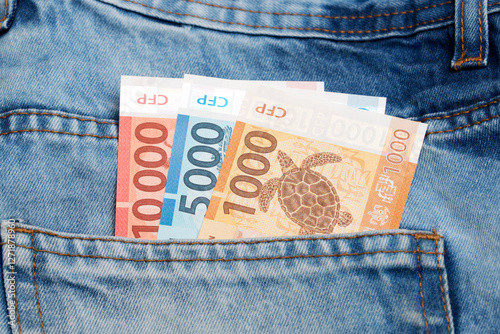 Billede på lærred CFP franc in the pocket of blue jeans