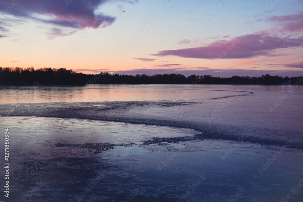 Scenic view of a frozen lake during evening Scenic view of a frozen lake during evening