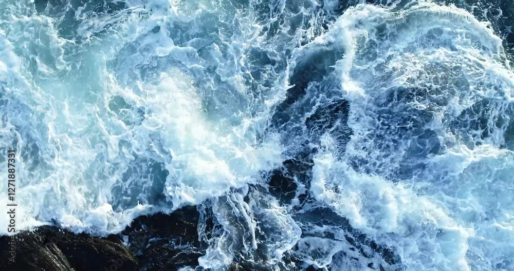 Storm hypnotic powerful waves crashing against rocky coastline in Norway, dramatic ocean scenery, Drone slow-motion footage 4K aerial view