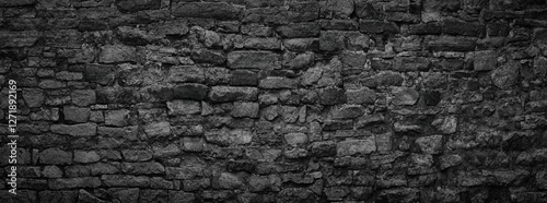 Panel kuchenny z motywem black stone wall an old castle, dark background of slate bricks
