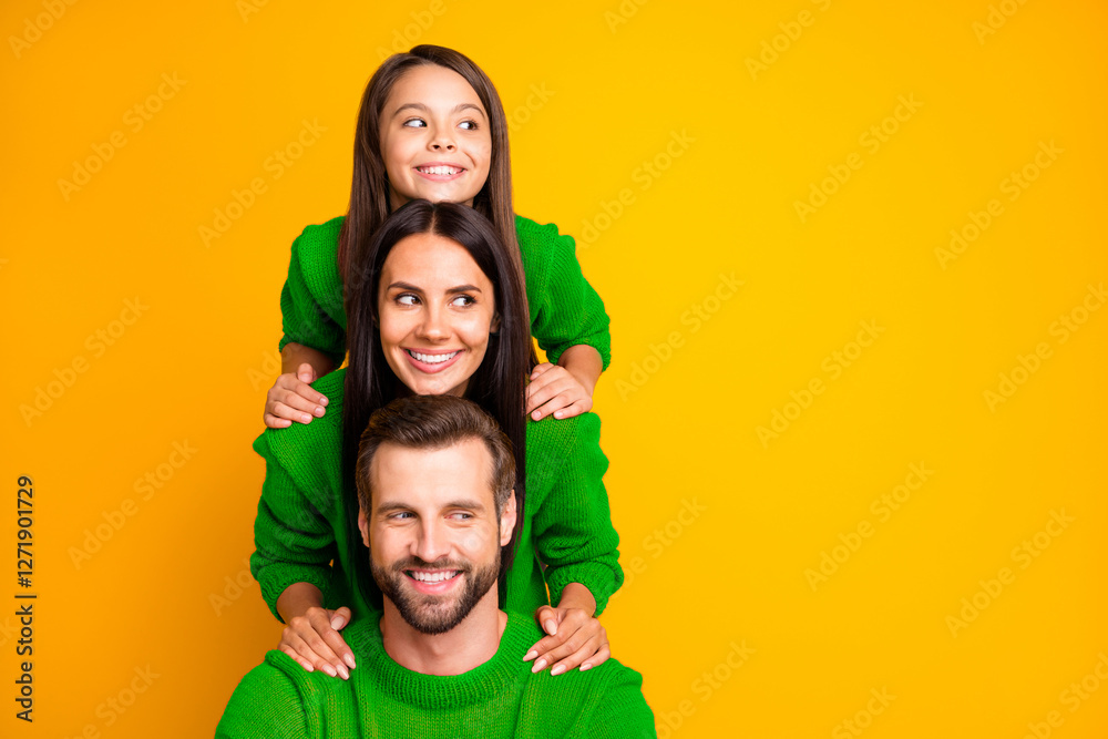 Photo of cute cheerful funny funky family having created pyramid looking away at empty space smiling wearing red sweater toothily isolated over vivid color background Photo of cute cheerful funny funky family having created pyramid looking away at empty space smiling wearing red sweater toothily isolated over vivid color background