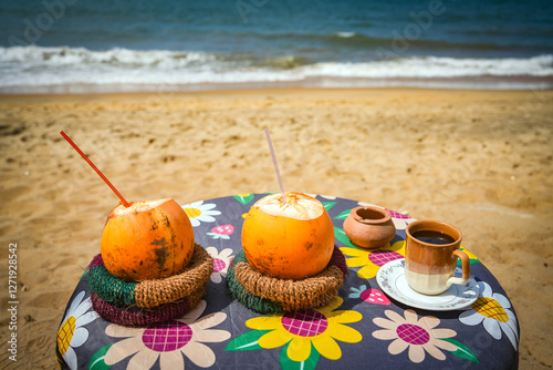 King coconuts on sale at a roadside stall in Sri Lanka. The coconuts are commonly used to provide a cheap, refreshing and sterile drink. photo