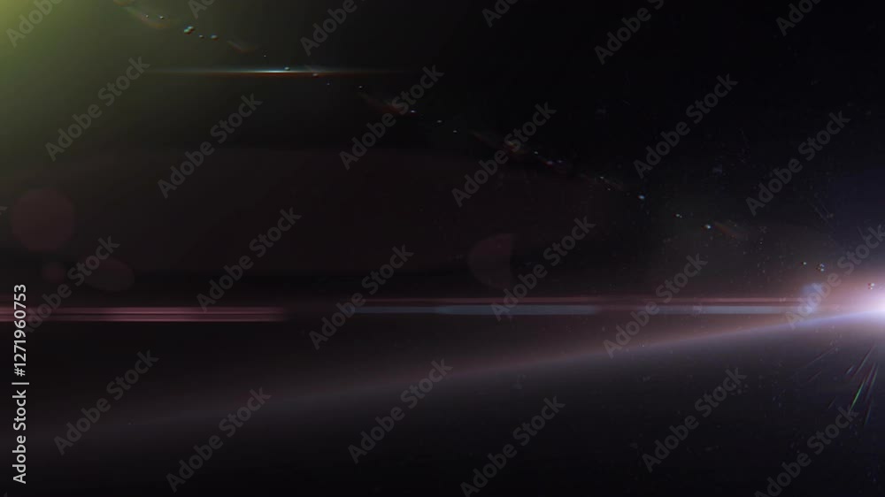 Light and lens flares transition on a dark background