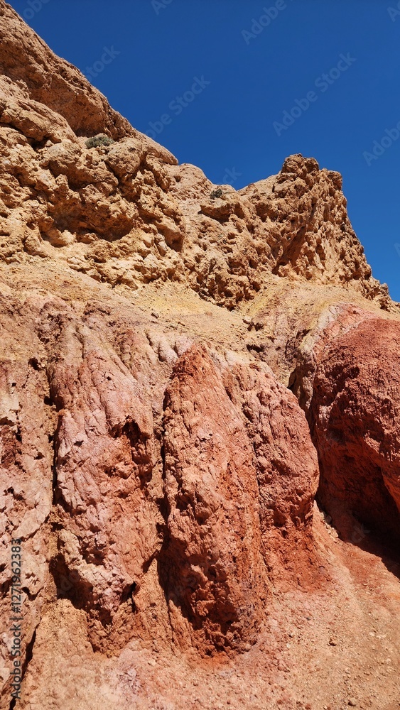 Scenic View of Fary Tale Canyon, Issyk-Kul, Kyrgyzstan- Stunning Red Rock Formations. Scenic View of Fary Tale Canyon, Issyk-Kul, Kyrgyzstan- Stunning Red Rock Formations.