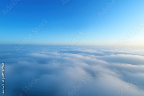 Fototapeta Naklejka Na Ścianę i Meble -  Beautiful aerial view above clouds with blue sky. View from airplane window.