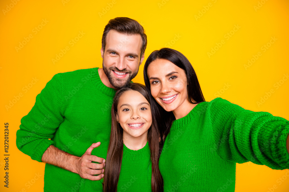 Photo of funny cheerful cute nice family with day mom taking selfie and dad hugging his daughter wearing red sweater people together isolated vibrant yellow color background Photo of funny cheerful cute nice family with day mom taking selfie and dad hugging his daughter wearing red sweater people together isolated vibrant yellow color background