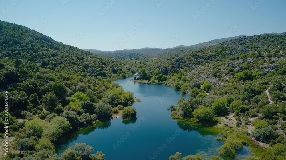 Aerial View of Serene Blue Lake Surrounded by Lush Green Hills Aerial View of Serene Blue Lake Surrounded by Lush Green Hills