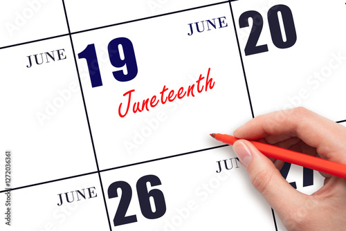 June 19. Hand writing text Juneteenth on calendar date. Save the date.