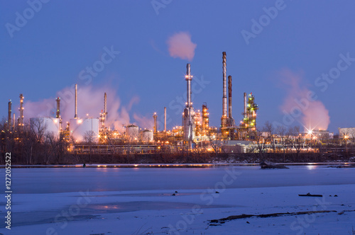 oil and petroleum refinery along frozen mississippi river in saint paul park minnesota at night