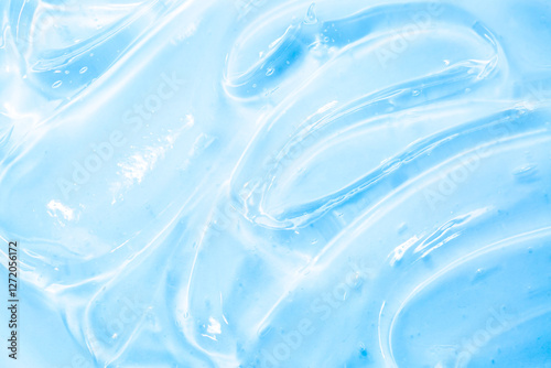 Cosmetic gel, serum transparent sample. Liquid cream with bubble texture. Gel texture of a cosmetic product. Clear liquid lotion for skin care.