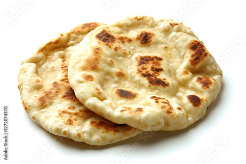 Two pieces of freshly baked naan roti bread with golden-brown charred spots, placed on a clean white background, highlighting their soft, fluffy texture and slightly crispy surface.