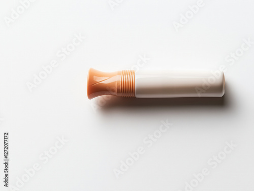 A Solo Plastic Whistle Featured Against a Simple White Background photo