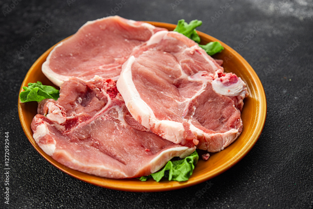 Raw pork on bones meat fresh tasty food dish delicious gourmet food background on the table rustic food top view copy space Raw pork on bones meat fresh tasty food dish delicious gourmet food background on the table rustic food top view copy space