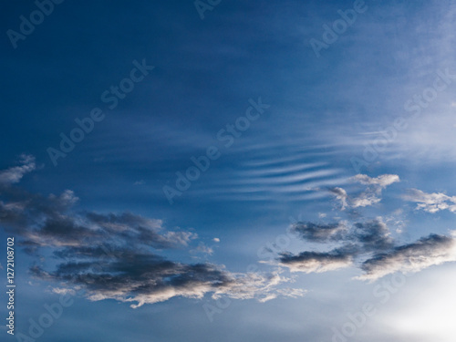 Blue sky with unusual cloud patterns, UK