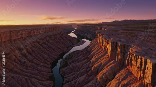 Serene sunset over canyon with winding river and dramatic cliffs