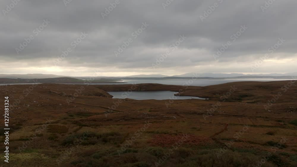 Beautiful Ireland - A breathtaking view showcasing rocky cliffs meeting calm, gentle waters beneath a vast, clear blue sky Beautiful Ireland - A breathtaking view showcasing rocky cliffs meeting calm, gentle waters beneath a vast, clear blue sky