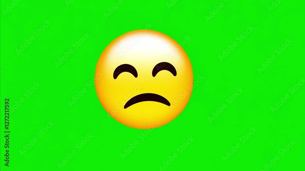 The sad face of an emoji is shown against a green background. The sad face of an emoji is shown against a green background.