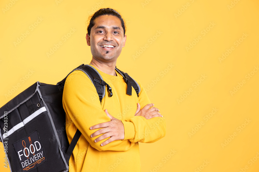 Portrait of jolly composed indian man with positive mood smiling, looking pleased, isolated over studio background. Upbeat person grinning, crossing arms, feeling satisfied Portrait of jolly composed indian man with positive mood smiling, looking pleased, isolated over studio background. Upbeat person grinning, crossing arms, feeling satisfied