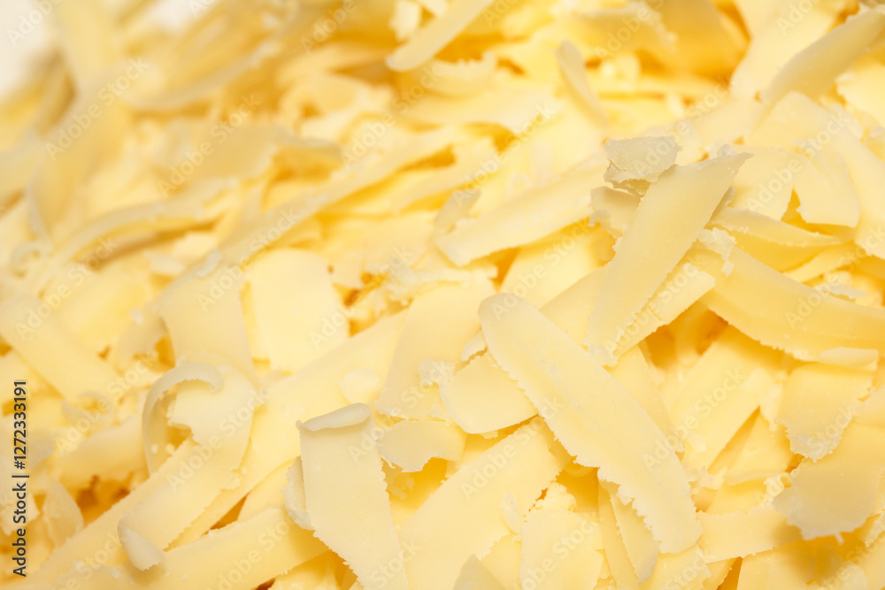 Close up of shreaded grated Chedder cheese Close up of shreaded grated Chedder cheese