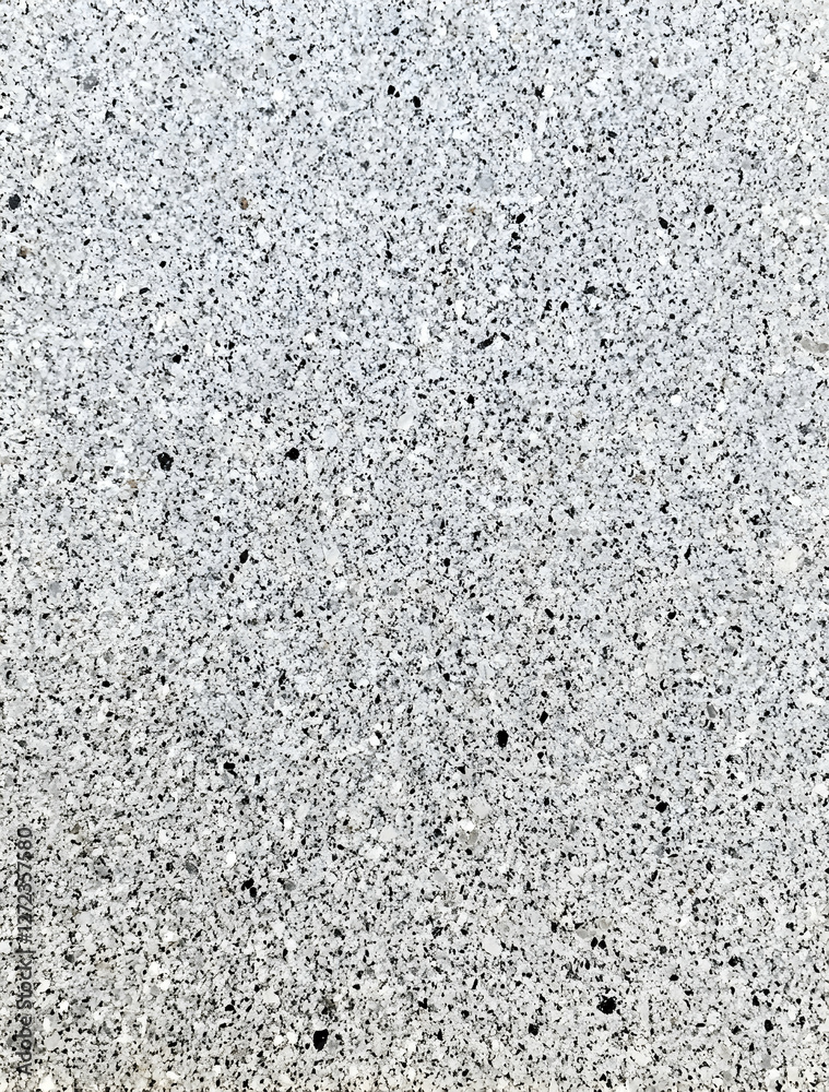 Detailed close-up of light gray terrazzo texture featuring a speckled pattern of black, white, and gray flecks for contemporary design projects Detailed close-up of light gray terrazzo texture featuring a speckled pattern of black, white, and gray flecks for contemporary design projects