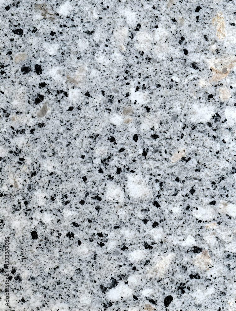 Subtle variations in tone and texture define this close-up shot of a granite surface, revealing a blend of mineral grain with muted elegance Subtle variations in tone and texture define this close-up shot of a granite surface, revealing a blend of mineral grain with muted elegance