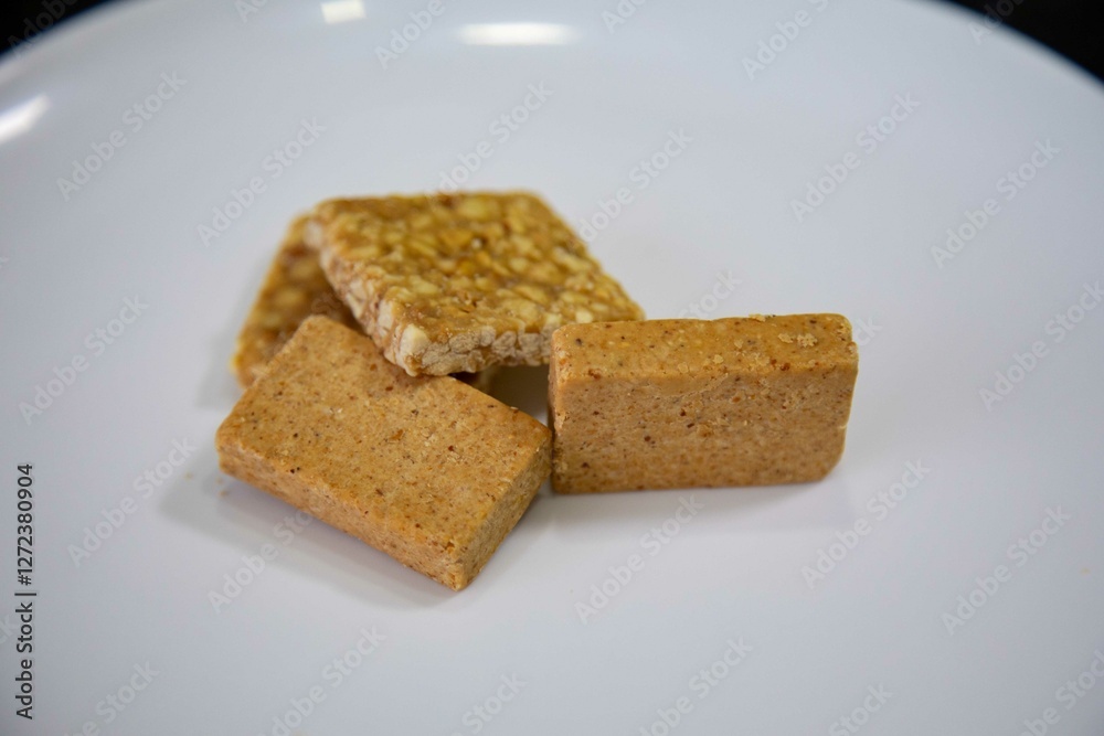 Paçoquinha is a sweet, crumbly Brazilian peanut candy made from ground peanuts and sugar, often enjoyed as a nostalgic snack Paçoquinha is a sweet, crumbly Brazilian peanut candy made from ground peanuts and sugar, often enjoyed as a nostalgic snack