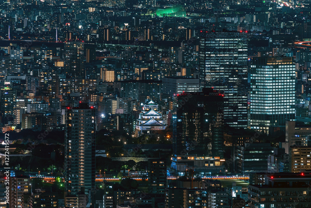 Dense buildings with Osaka castle at Osaka central area at night