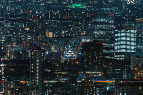 Obraz na płótnie Dense buildings with Osaka castle at Osaka central area at night w salonie