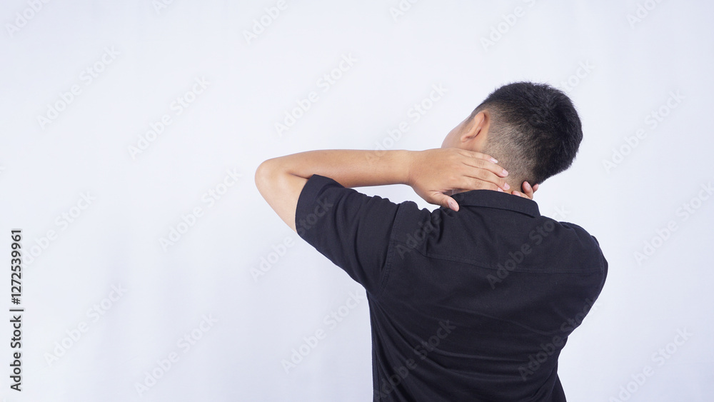 Rear View of Man Touching His Neck Suffering from Pain Isolated on White Background Rear View of Man Touching His Neck Suffering from Pain Isolated on White Background