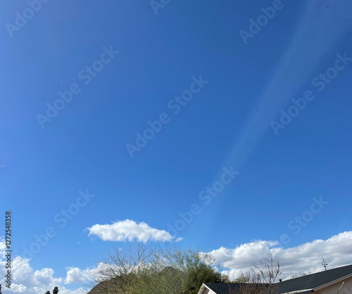 blue sky with clouds and rainbow