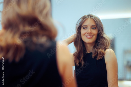 Woman Admiring her New Looks in a Hair Salon. Confident lady feeling positive and trendy after hair makeover 
 photo