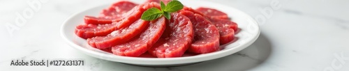 White plate with raw minced beef strips on surface, meat, whiteness