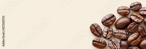 Close-up of coffee beans on textured neutral background