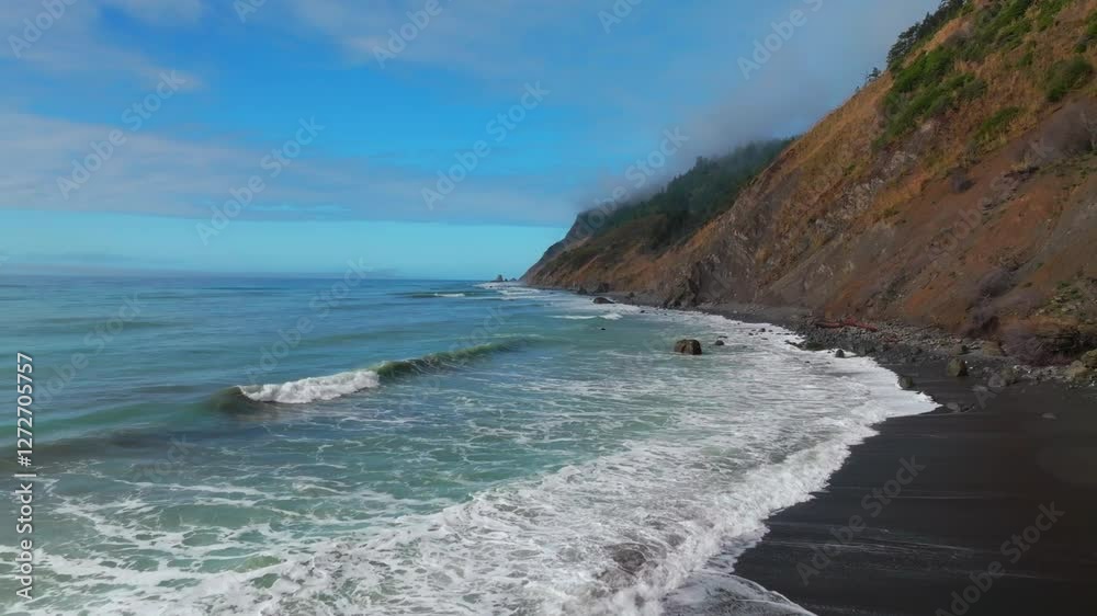 Waves crashing surf black sand rugged coastline sunny morning blue sky mist fog layer USAL Beach Campground Lost Coast Trail California aerial drone PNW boulders rocks mountainside backwards motion Waves crashing surf black sand rugged coastline sunny morning blue sky mist fog layer USAL Beach Campground Lost Coast Trail California aerial drone PNW boulders rocks mountainside backwards motion