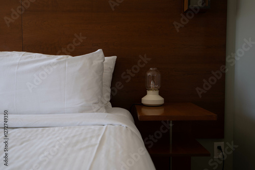 Hotel room details, home decor and interior design, bed with white sheets, furniture details