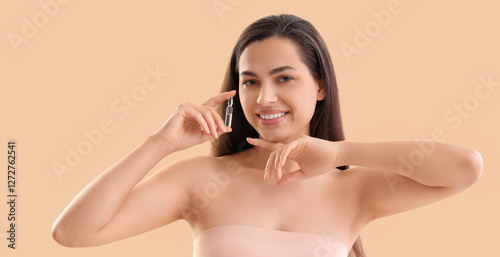 Beautiful young woman holdi...