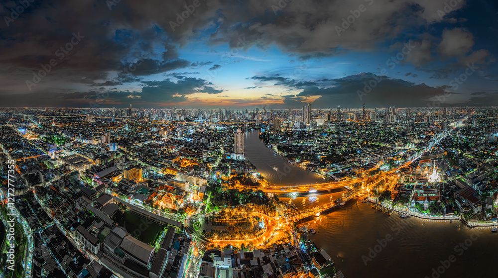 Obraz premium Aerial view of skyscrapers over the financial and tourist district of Bangkok city, along the Chao Phraya River. City skyline, Bangkok, Thailand.