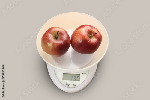 red apples on a scale. Apple kilogram