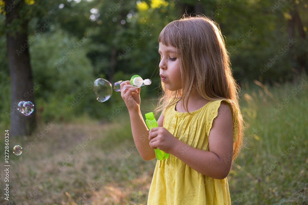 cute kid girl blowing bubbles on park outdoors nature cute kid girl blowing bubbles on park outdoors nature