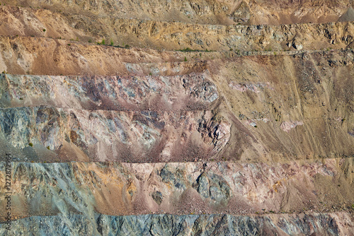 close-up view of a geological formation, layered strata,variation in color and texture, ranging from grays to brown. layers horizontal line, Natural background, geology rock texture, open pit surface