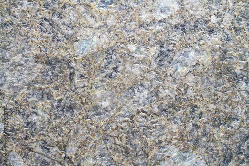 Texture of natural stone close-up. Natural unpolished granite. photo