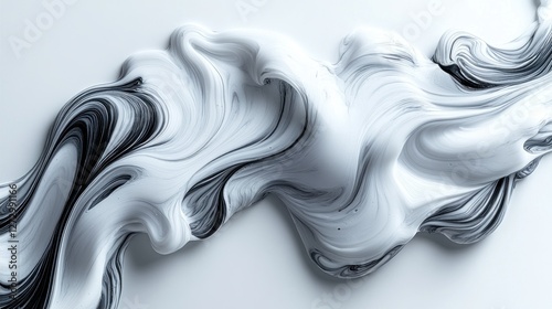 Abstract white and black paint swirl on a smooth surface photo