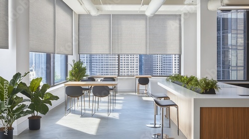 Modern office breakroom with city view, sunlight, plants, and neutral tones.
