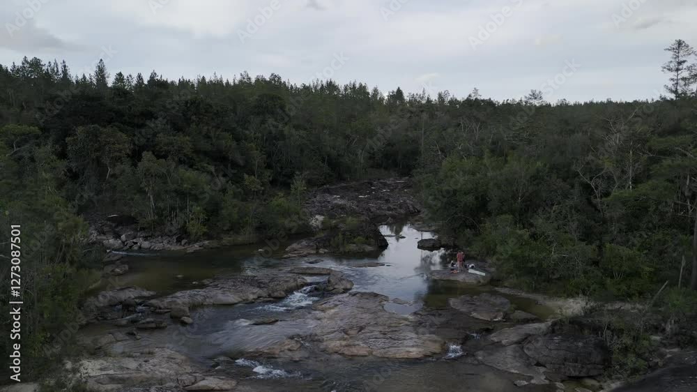 Drone rises up from water in Rio On Pools in Mountain Pine Ridge Forest Reserve in Belize Drone rises up from water in Rio On Pools in Mountain Pine Ridge Forest Reserve in Belize