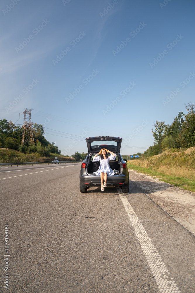 Woman Enjoying a Sunny Day by Her Car
