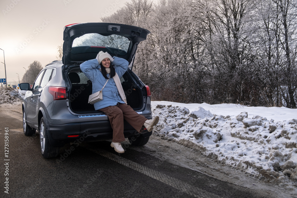 Woman Relaxing in Car on Snowy Road