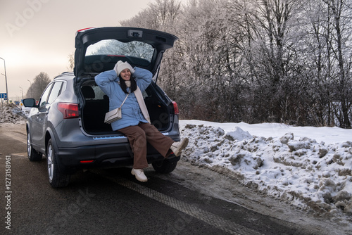 Obraz na płótnie Woman Relaxing in Car on Snowy Road w salonie