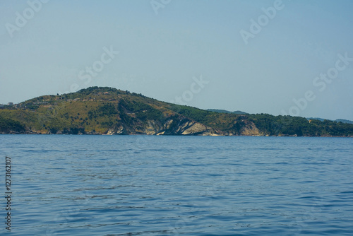 The Ionian coastline south of Sarande, part of the Albanian Riviera. Here, the green hills of the Ceraunian mountain range meet the Straits of Corfu in the eastern Mediterranean Sea
